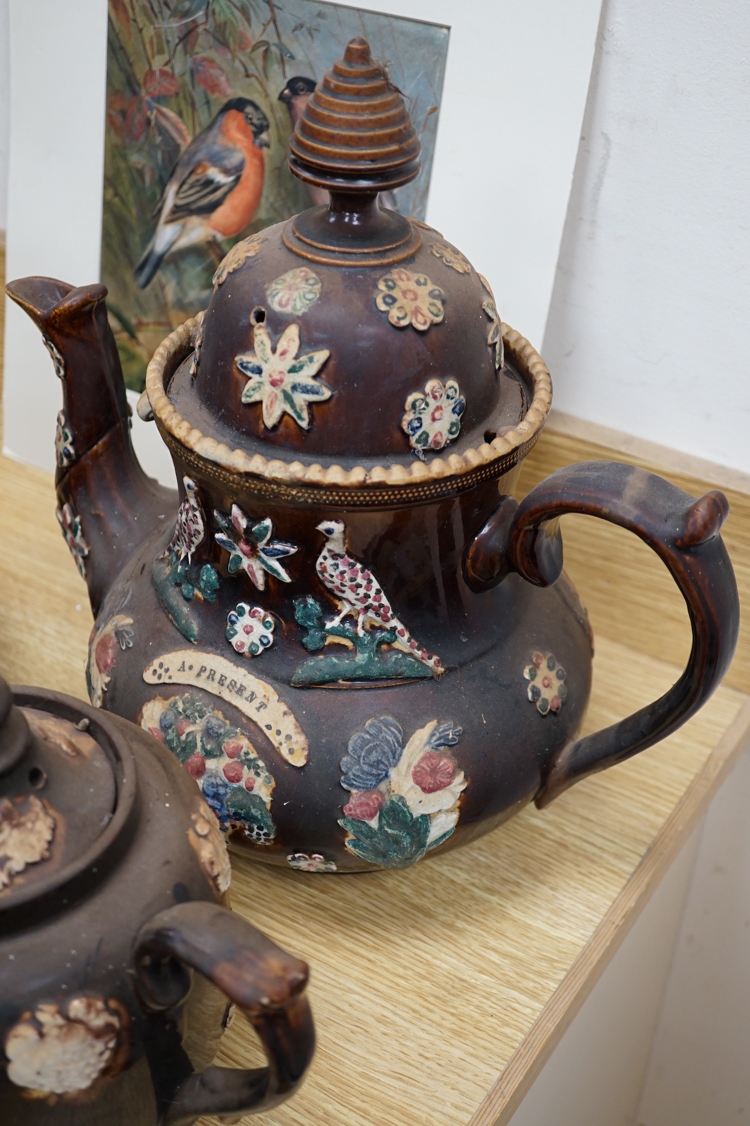 Measham Barge ware glazed pottery including teapots and jugs, decorated in relief, largest 28cm wide